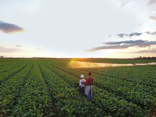Young farmers working in field