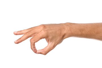 Male hand showing OK gesture on white background