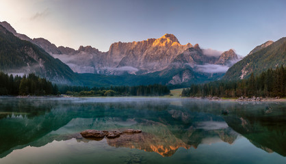 Fototapeta na wymiar Panorama of a beautiful mountain lake in the Italian Julian Alps-Laghi di Fusine