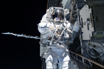 Tied astronaut in outer space on a space station. Elements of this image were furnished by NASA