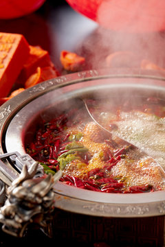 Traditional Chinese Sichuan Spicy Hot Pot, Closeup Boiling Soup