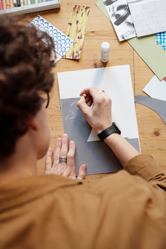 Woman creating abstract collage