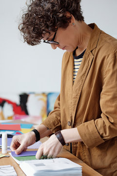 Creative woman making colorful collage