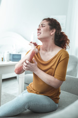 Woman feeling awful having scratches and reddening on her arm