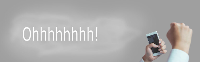 A person with a smartphone is surprised or happy.  Good business results, winning a lottery, watching sports or selling, etc.　スマートフォンを手に持った人が驚いているまたは、喜んでいる様子。ビジネスの好結果、宝くじが当たる、スポーツ観戦、安売りなど