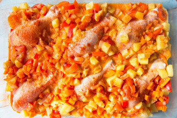 Stewed chicken legs with vegetables and sauce