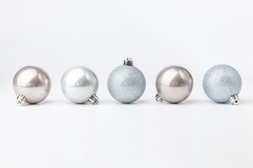 Five colored Christmas balls on white background. Christmas decor and toys. 