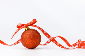 Christmas balls with red ribbon on white background. Christmas decor and toys. 