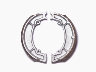 Motorcycle brake pads on a white background.
