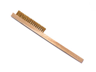 Brass wire brush on a white background.