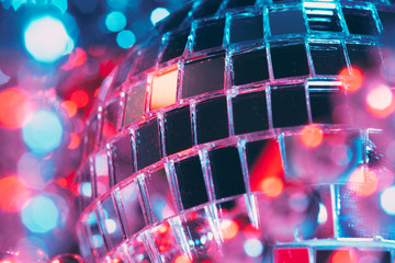 Shiny disco party background with mirror balls reflecting light