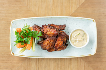 chicken wings grill. Serving on a white plate on a table. Barbecue restaurant menu, a series of photos of different meats