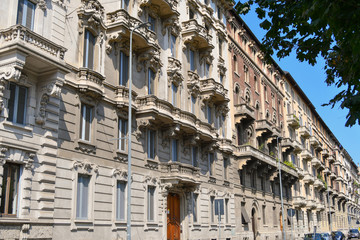 Fototapeta na wymiar Old fashioned houses of a Street in Milan