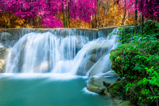 Amazing in nature, beautiful waterfall at colorful autumn forest in fall season © totojang1977