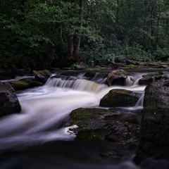 Water streaming in river in summer night