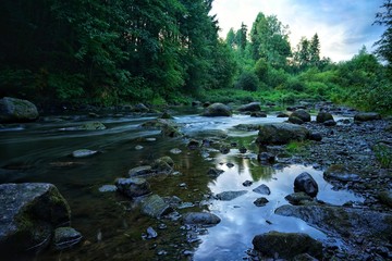 Water streaming in river in summer night