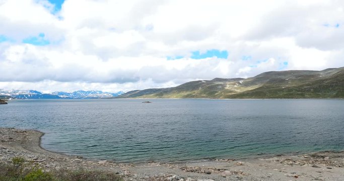 Oppland, Tyin Lake, Norway. Stones On Coast Of Beautiful Lake Tyin In Summer Cloudy Day. Norwegian Nature