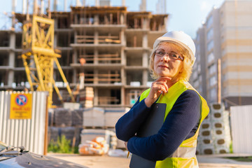 Woman Builder working on a construction site at home