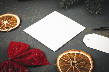 Christmas  background with letter, envelope and feather  pen surrounded by seasonal decorations