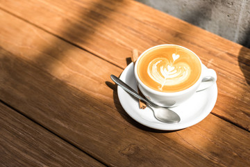 cup of coffee on wooden table