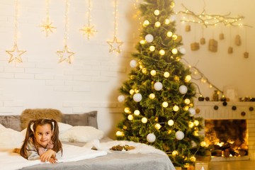 Adorable girl waiting for Santa