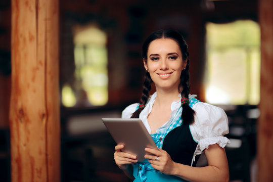 Oktoberfest Bavarian Waitress Holding PC Tablet Welcoming Guests