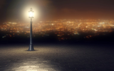 Illuminated street light in front of blurred city view. 3d rendering