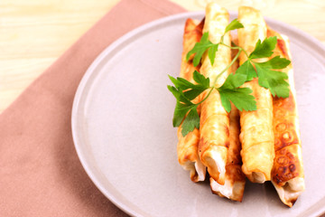 Traditional Turkish Pastries sigara borek - Deep Fried pies with cottage cheese and parsley.