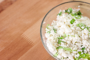 Cottage cheese with chopped parsley. Diet food