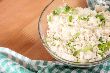 Cottage cheese with chopped parsley. Diet food