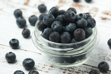 A glass bowl with blueberry