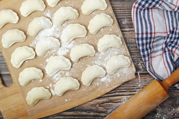 The process of cooking traditional vareniki - textured background	