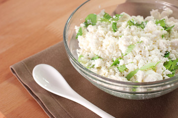 Cottage cheese with chopped parsley. Diet food