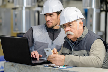 industrial engineers researching on the laptop