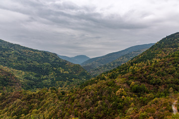 Autumn landscape view in Rhodope Mountains with green, yellow and orange leafs 