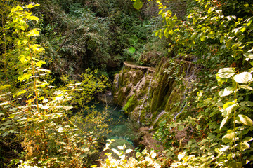 Krushuna Falls are a series of waterfalls in northern Bulgaria, near Lovech. They are famous with their landscape and are formed by many travertines and turquoise blue water.