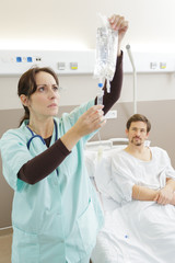 nurse preparing iv infusion in the hospital