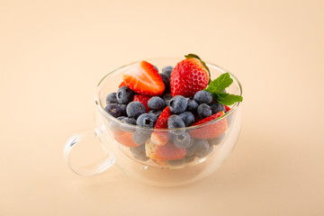 Fresh berry mix in tea cup
