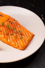 Grilled salmon with lemon on plate