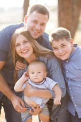 Cute young family spending time together in nature