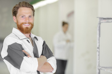 Fototapeta premium portrait of a young bearded painter and decorator