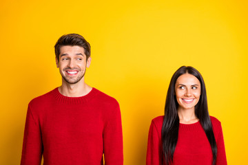 Portrait of lovely couple look having date wear red pullover isolated over yellow background