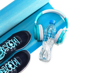 Yoga Mat, sports shoes, water bottle concept of healthy living, healthy eating, sports and diet