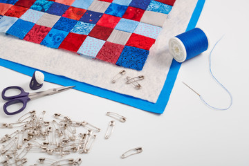 Assembling of a quilt sandwich, curved basting pins and sewing accessories