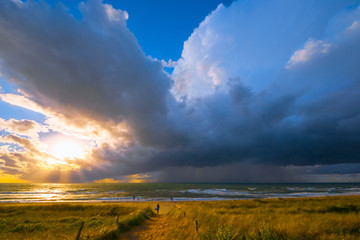 Fast weather change after days rather boring weather. Welcomed by the people. Baltic Sea in summer. People did not even shy away from approaching lightning and thunder. (The photographer fled...)
