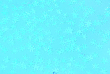 Holographic foil snowflakes confetti sparse on trendy blue background. Simple holiday concept. Winter festive backdrop. Top view, flat lay