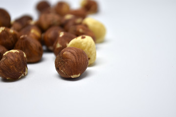 Heap of hazelnuts on a white background. Raw hazelnuts isolated on white background.