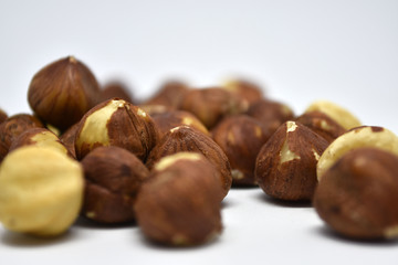 Heap of hazelnuts on a white background. Raw hazelnuts isolated on white background.