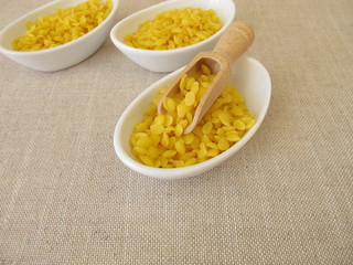 Pure beeswax pastilles for natural cosmetics, candles or beeswraps