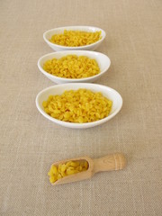 Pure beeswax pastilles for natural cosmetics, candles or beeswraps